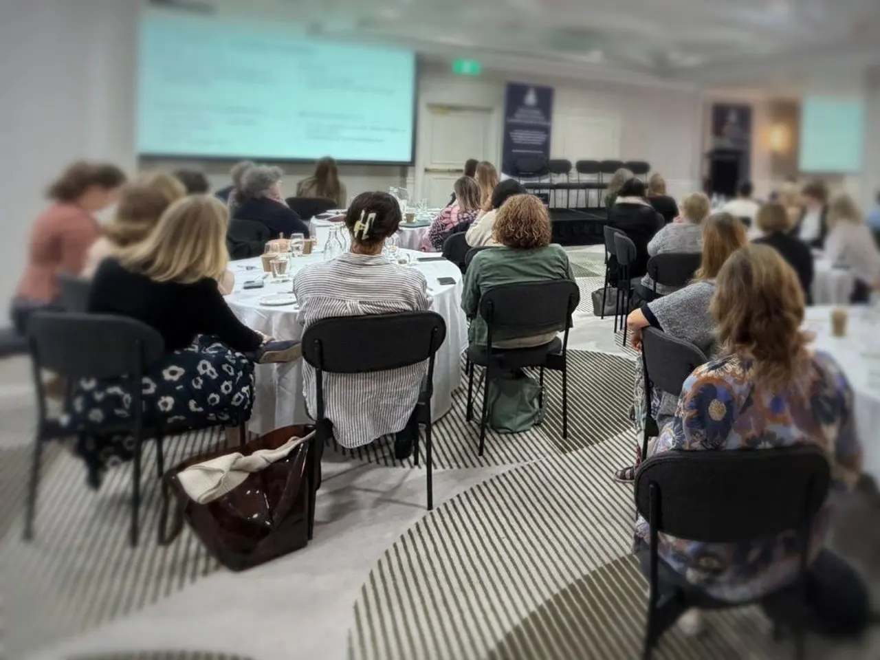 Members at round tables during a BMNANZ conference session